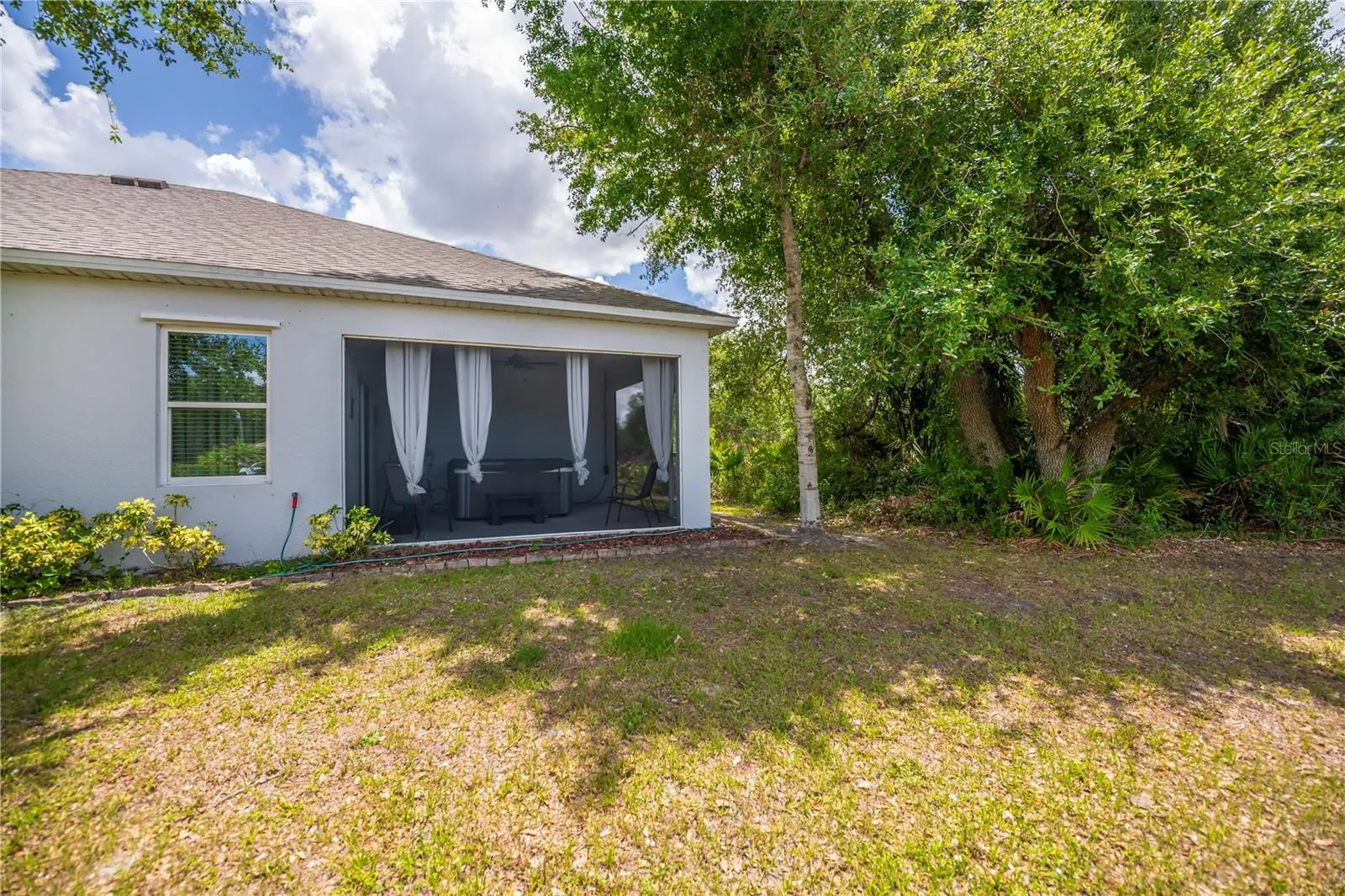 Mature Landscaping and Peaceful Wooded Greenbelt Views.