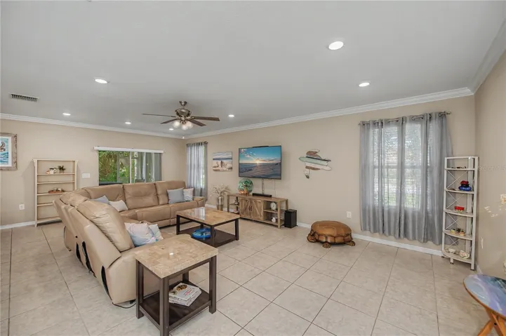 HUGE living room with sliders to back screened lanai