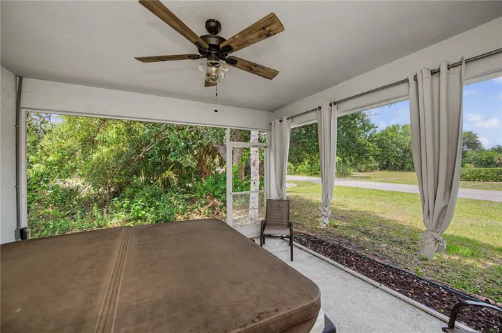 back lanai is screened with wooded greenbelt and room for a pool