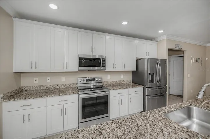 Chef's Kitchen with Granite Countertops, Stainless Steel Appliances &amp; Abundant Cabinetry.