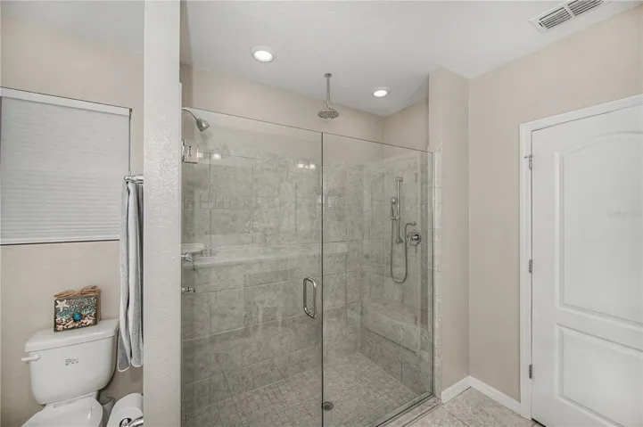 Walk-In Shower with Seamless Glass Enclosure.