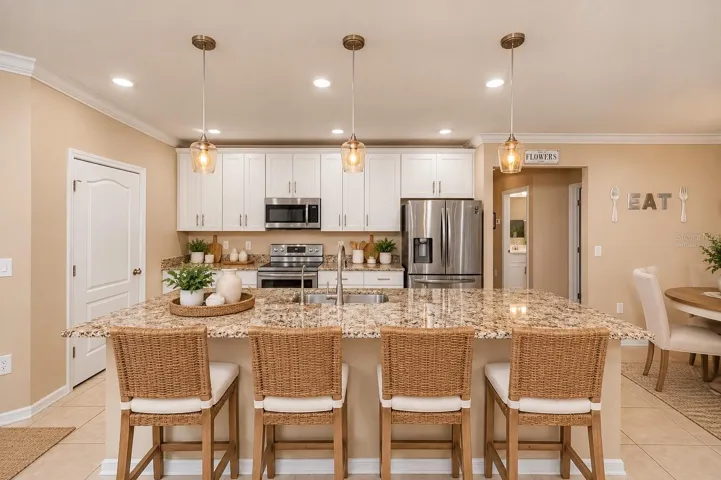 Virtually Staged Granite Island and Walk-In Pantry.
