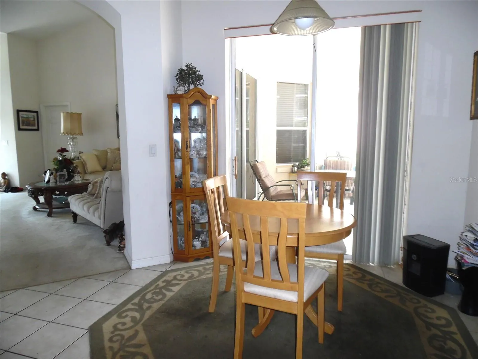 Kitchenette area off kitchen with sliding glass doors leading to back patio