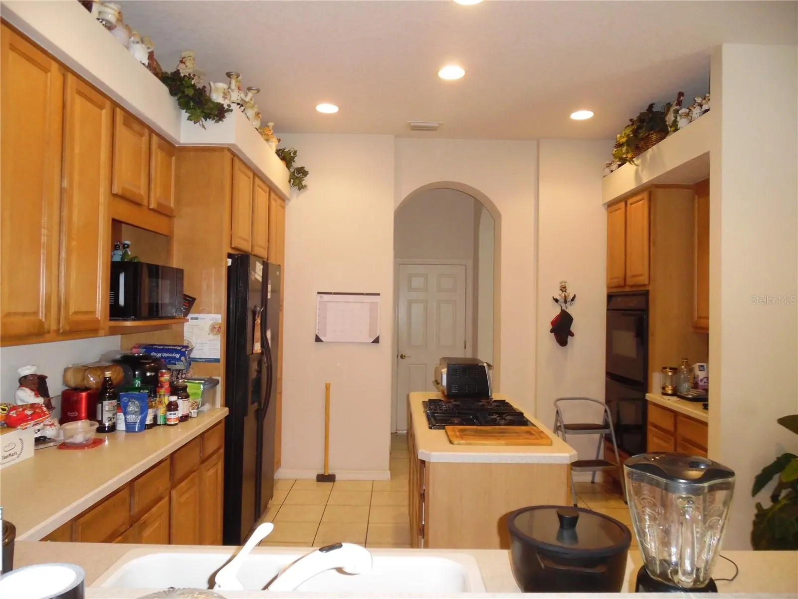 Kitchen showing island, double over on right side