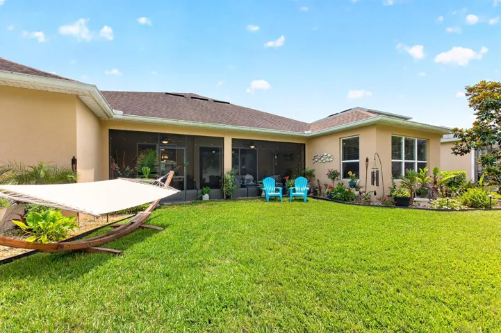 Manicured backyard is move in ready.
