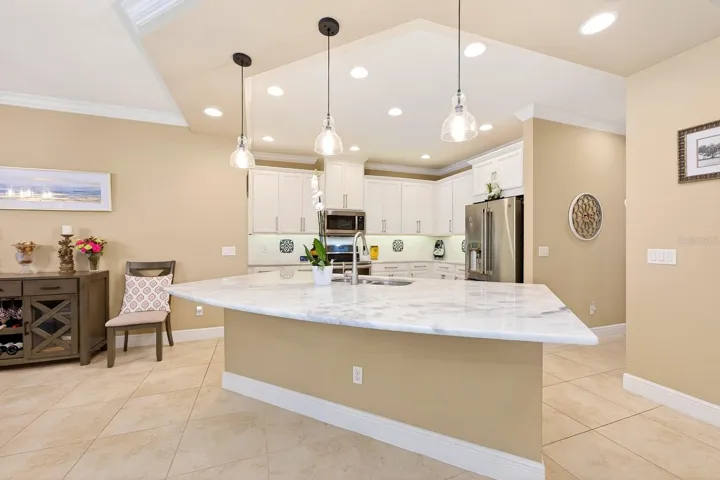 At the heart of the home, the chef’s kitchen was designed to impress with 42” custom solid wood cabinetry topped with crown molding, CUSTOM GRANITE COUNTERTOPS, a steel-reinforced 8’ ISLAND, built-in Keurig refrigerator feature, premium Allen & Roth hardware, and an open layout that keeps everyone connected.