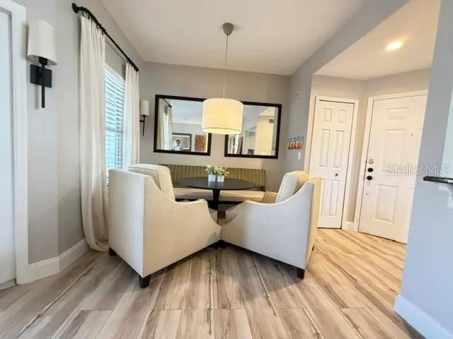 Dining area - front door entrance and storage closet