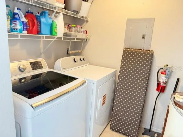 Inside laundry room just off the kitchen (W&D convey!)