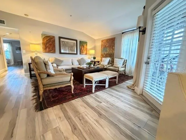Living room with light from 2 sides- balcony door and window and brand new LV floors