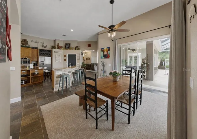 Dining room with sliders to pool