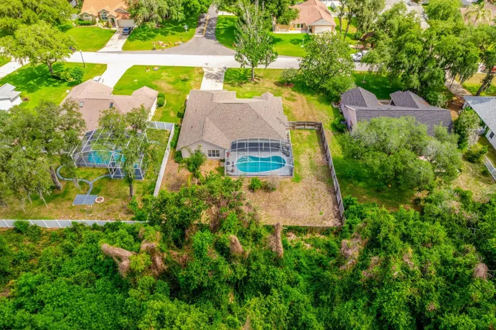 Aerial view of the back of the home and neighborhood.