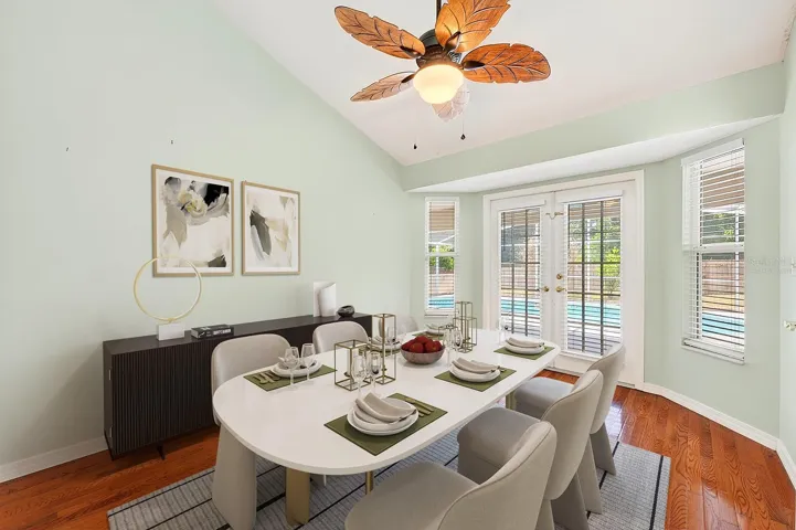 A VERSATILE BONUS ROOM with hardwood floors and French doors to the lanai offers ENDLESS POSSIBILITIES as a 4th Bedroom, formal Dining Room, Office, or flex space. Virtually Staged