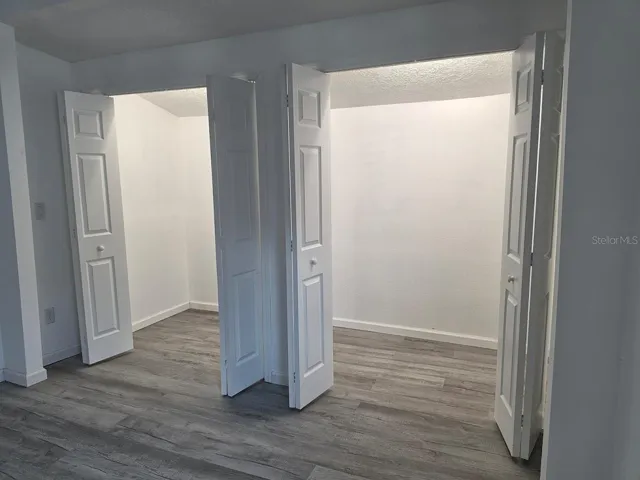 Spacious primary closets featuring abundant lighting and ample storage space for organization and convenience.