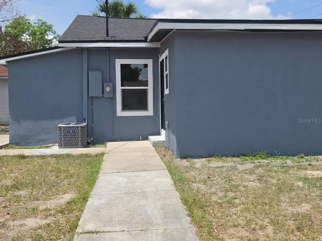 Convenient side entry access offering added functionality and easy flow to the backyard and living areas.