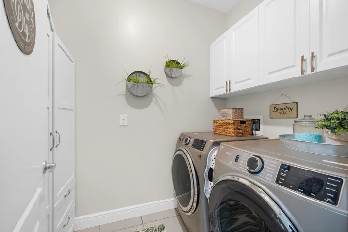 Indoor Laundry Room With GE Washer And Drye