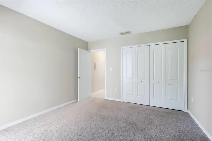 third bedroom w/ two closets and slider to lanai