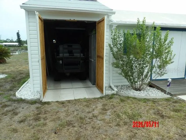 Separate but attached shed for parking your Golf Cart