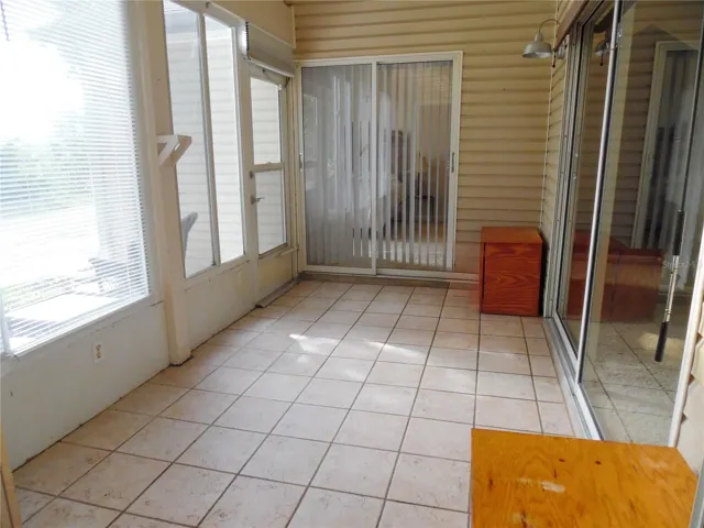 Enclosed back patio overlooking golf course