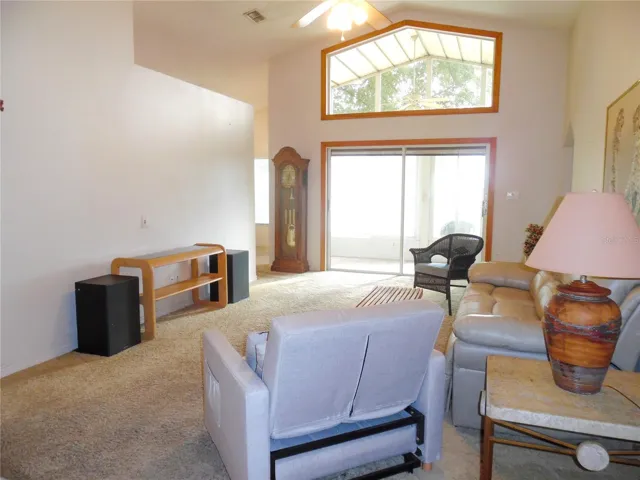 Living Room with sliding glass doors leading to enclosed back patio
