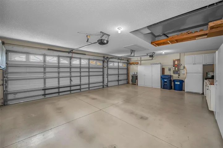 large 3 car garage, pull-down attic storage.