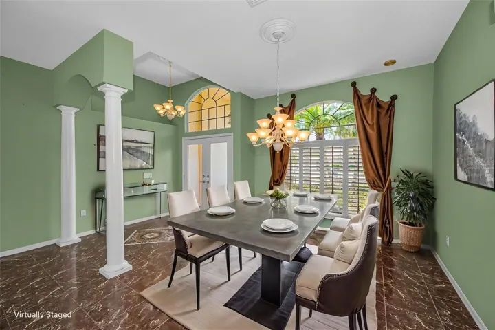 Virtually staged photo  to show dining room space as you enter.