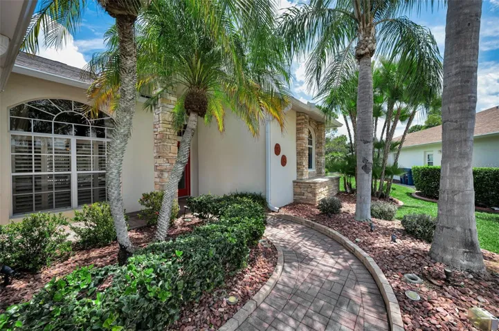 Nicely landscaped and a pavered walkway