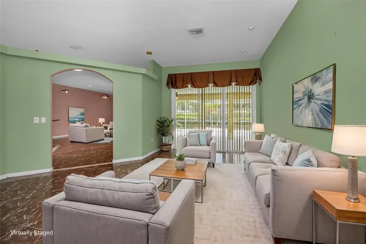 Virtually staged photo  to show livingroom space as you enter.