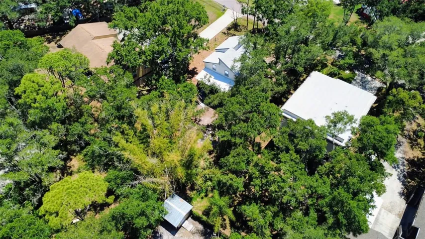 Aerial View showing double lot. Middle home