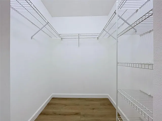 Walk-In Closet in Primary Bedroom Suite