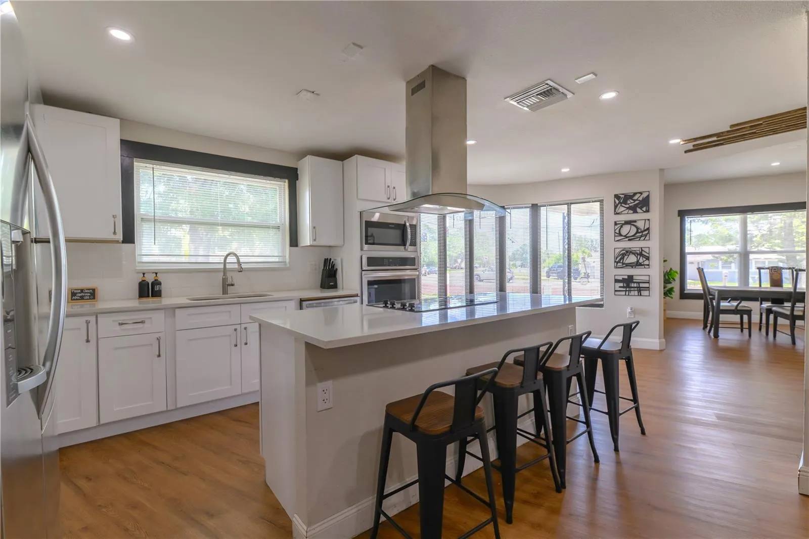 Kitchen Area with Floating Island, Hood, Breakfast Nook, Dining Room