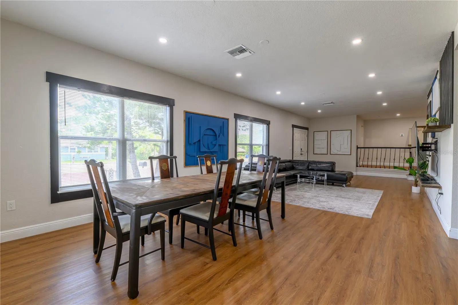 Dining/Living Area Open Concept with Wall Mounted Wood Decor