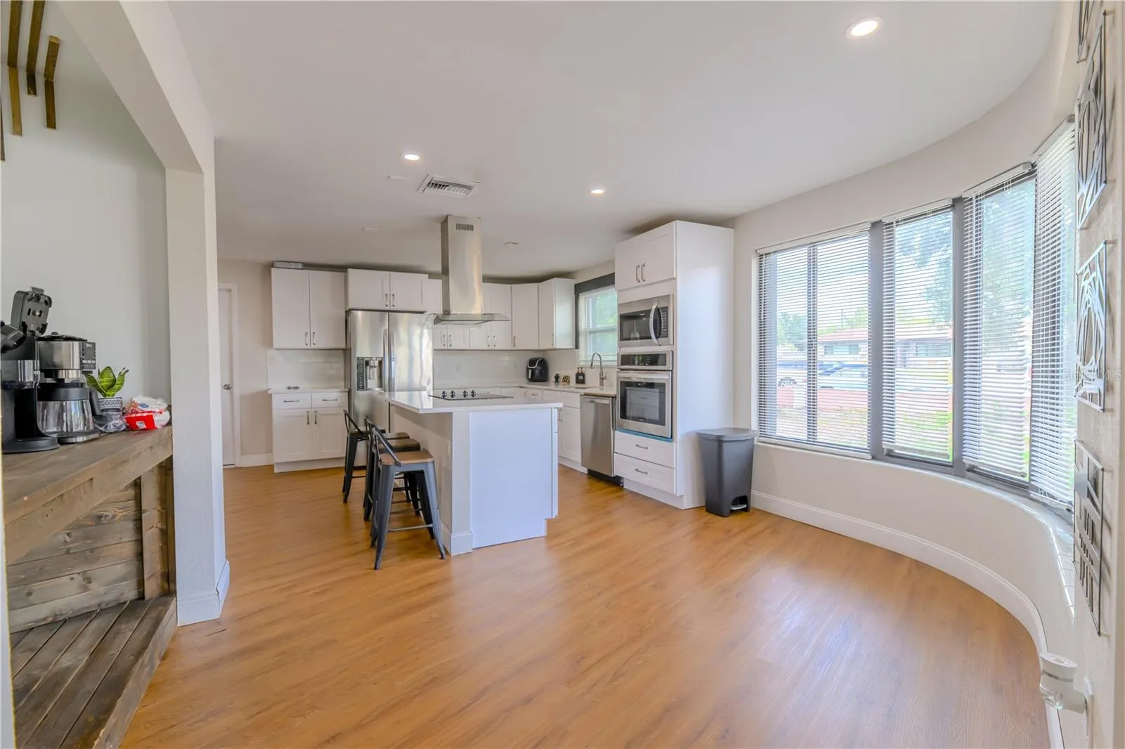 Breakfast Nook & Kitchen with Stainless Steel Appliances:  Fridge, Dishwasher, Microwave & Stove