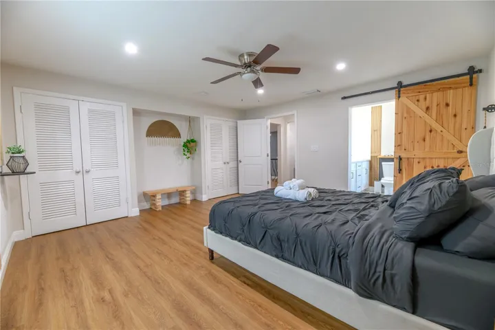 Primary Bedroom Dual Closets, Entryway & Ensuite Bathroom with Barn Door