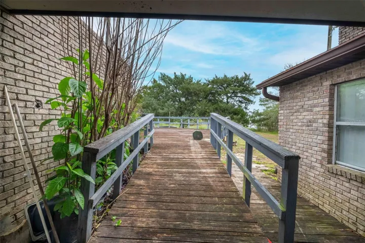 Covered porch connecting the main house to the garage and deck