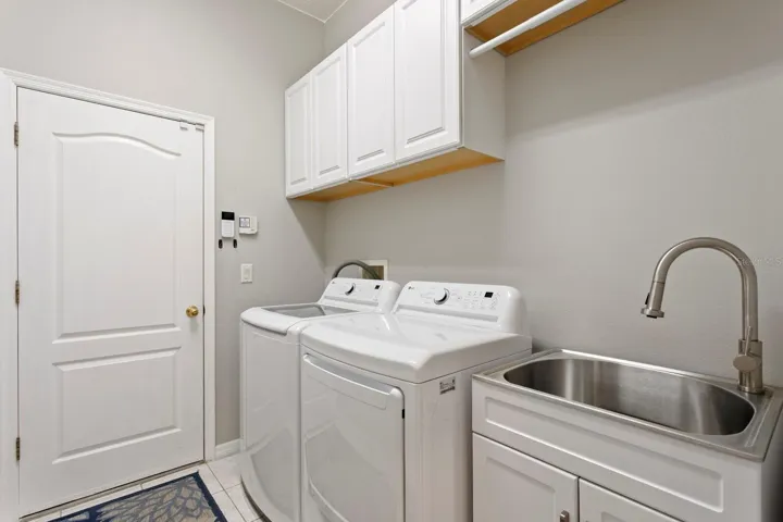 Inside utility room leads out to large 3-car garage