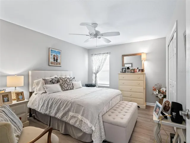 Easy-care vinyl flooring, ceiling fan, and sun-filled windows creating a warm atmosphere.