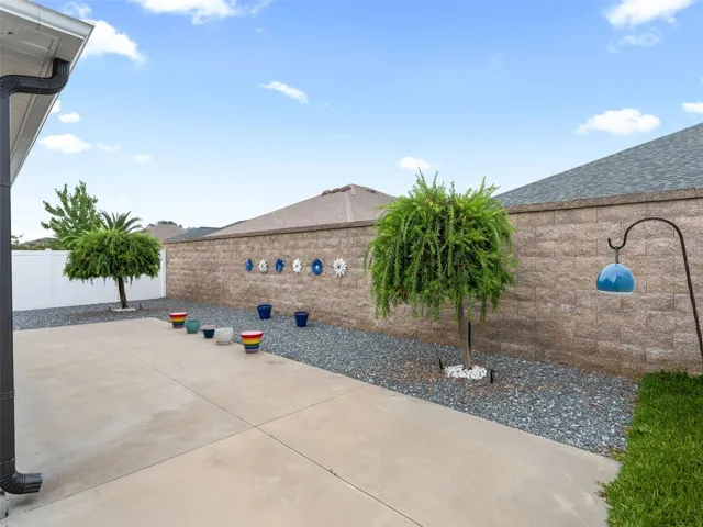 Beautifully designed outdoor space offers privacy, an expansive patio for entertaining, and easy-care landscaping for effortless upkeep.