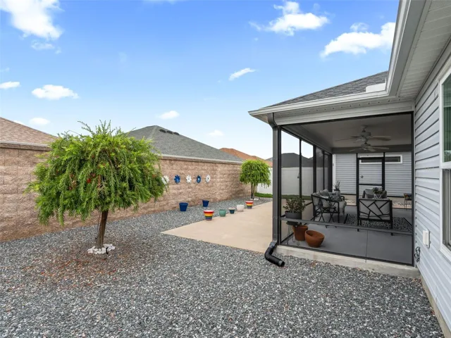Beautifully designed outdoor space offers privacy, an expansive patio for entertaining, and easy-care landscaping for effortless upkeep.