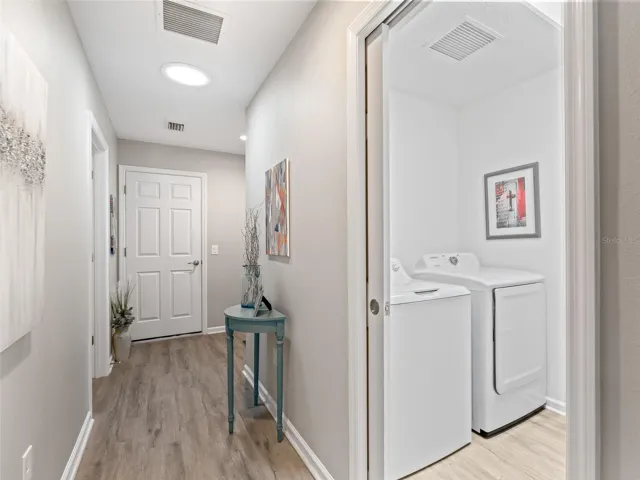 Welcoming foyer hallway opens seamlessly into the spacious open-concept living area.