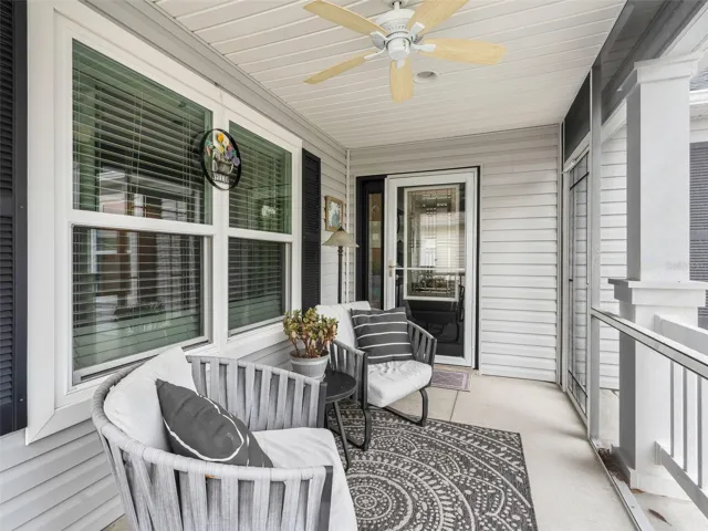 Enjoy morning coffee on your comfy, screened-in porch. Porch furniture conveys with home.