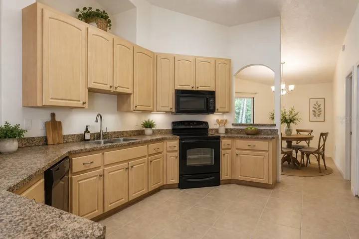 Virtually staged kitchen and casual dining area
