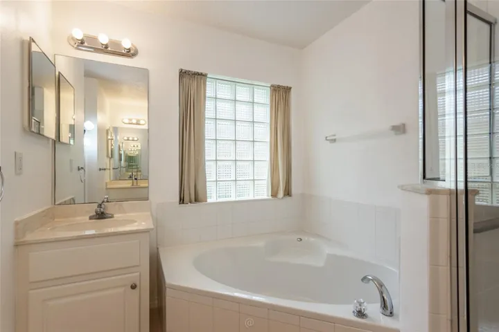 Check out that garden tub - perfect for relaxing.  Separate  sinks in primary bath.