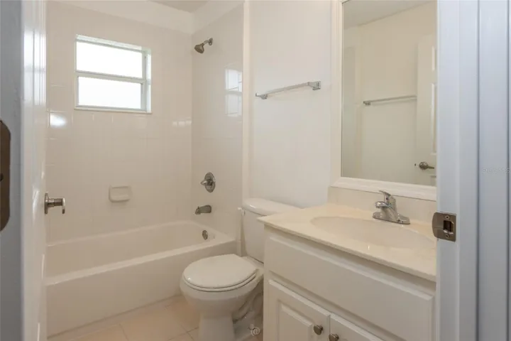 Guest bathroom separates bedroom 2 and bedroom 3.