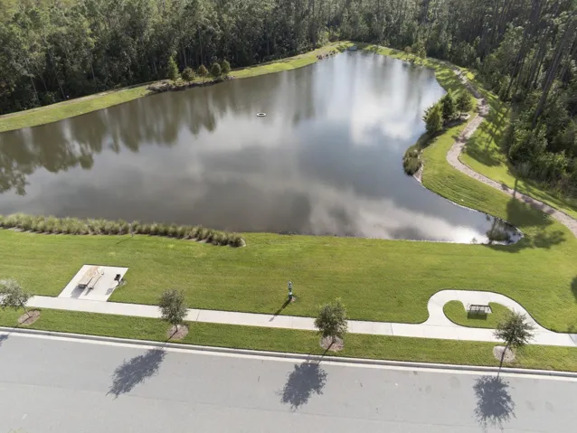 community area with walk path around pond