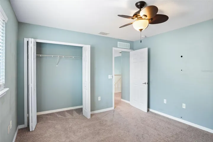 Standard closet in the fourth bedroom on the second floor located in the rear of the home