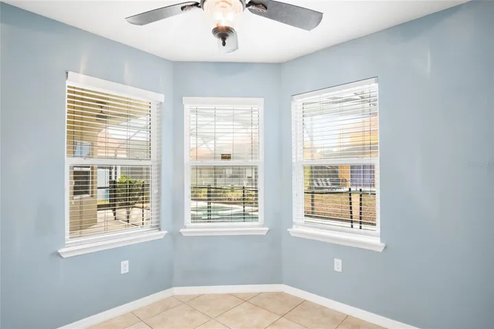 Dining nook with a triple window view