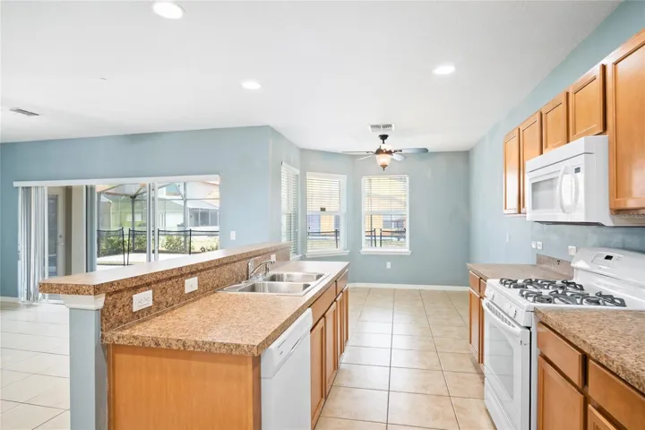 View of the kitchen, dining nook and living room from the front family room