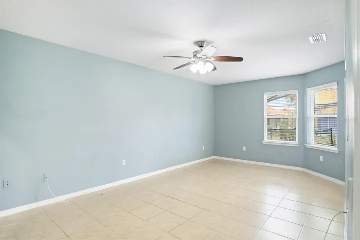 First floor primary suite with pool access and view