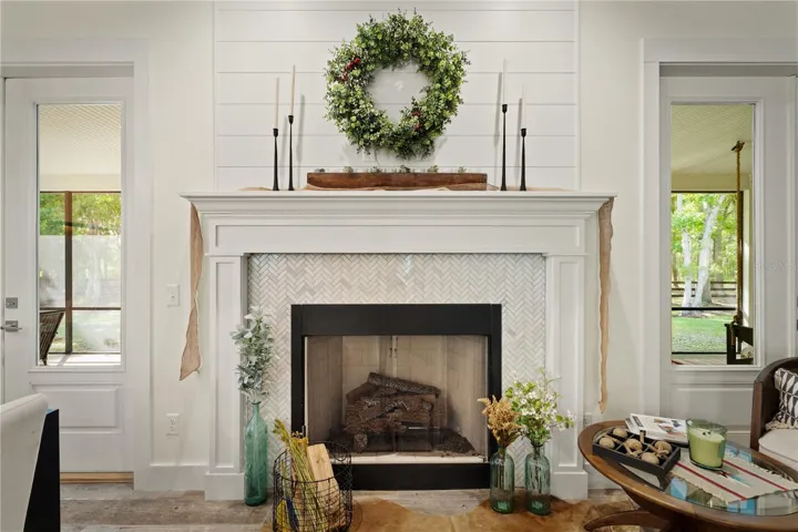 Fireplace centered between double french doors