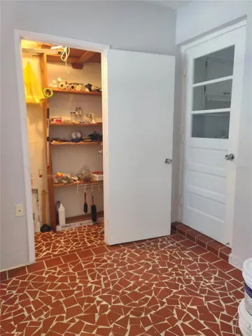 Florida Room Storage Closet and Door to Kitchen